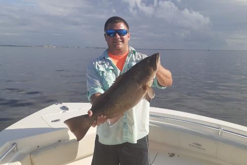 Josh Patterson holding a big fish  he caught