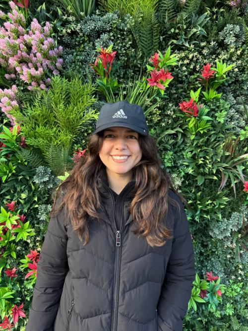 Krystal Renta in front of a flower wall